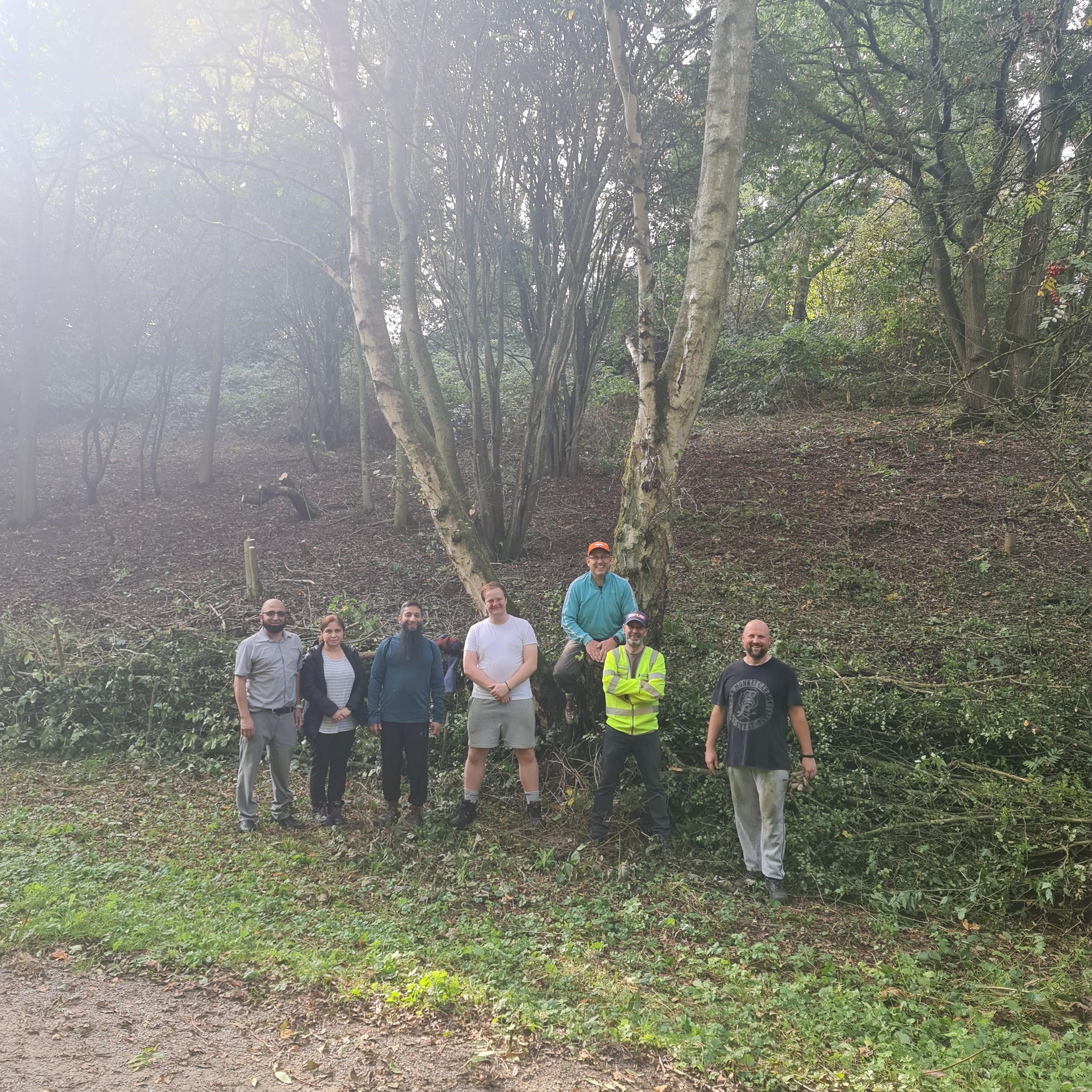 Caption: National Highways volunteers working to clear scrubland in Rugby.