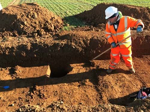 Archaeologist in a trench