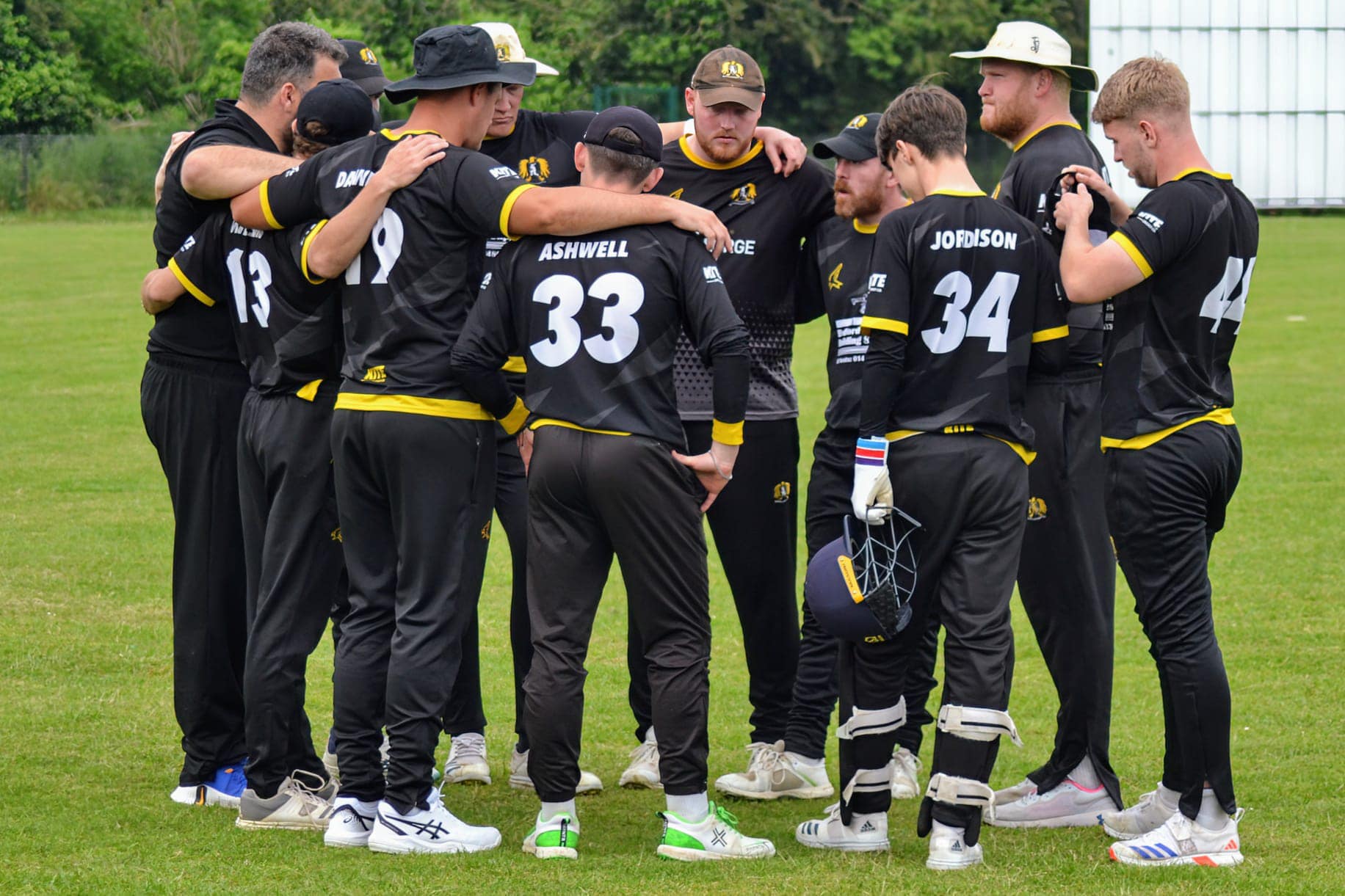 Group of sports people in a huddle