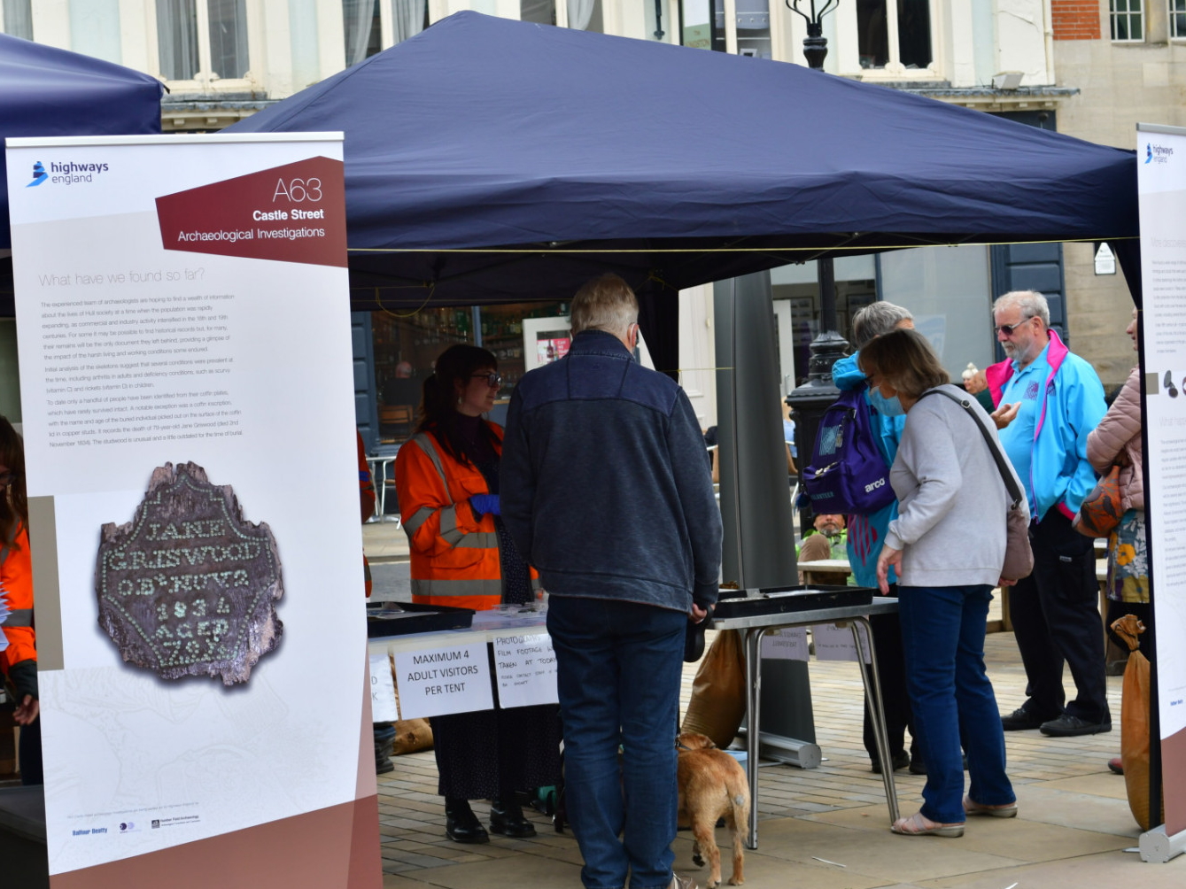 A group of people looking at findings at the Hull Archaeology Showcase Event