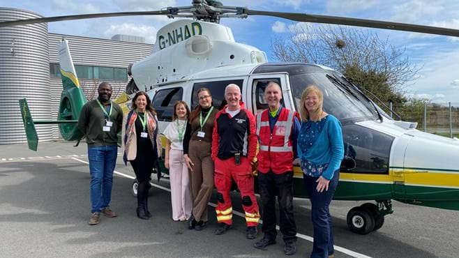 Staff with GNAA and staff at the GNAA HQ